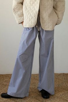 Stay comfortable and stylish with our Pilar Striped Lounge Pants. With a relaxed fit and high waist, these straight leg pants provide both comfort and a flattering silhouette. The elastic waistband and adjustable robe belt ensure the perfect fit for all-day wear. Elevate your loungewear game with these versatile and chic pants. Relaxed Fit Color: White/Blue Stripe Elastic Waistline w/ Adjustable Rope belt High Waist 2 Side Pockets Straight Leg 100% Polyester Stripe Pants Outfit, Striped Lounge Pants, Vintage Lounge, High Waist Wide Leg Pants, Striped Wide Leg Pants, Chic Pants, Pants Fabric, Pants Vintage, Denim Accessories