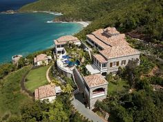 this is an aerial view of the house and its surrounding grounds, overlooking the ocean