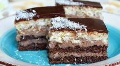 three pieces of cake sitting on top of a blue plate