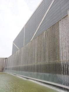 water gushing out from the side of a building