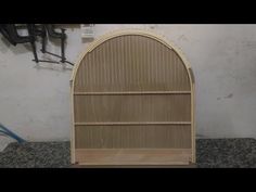 a wooden book shelf sitting on top of a counter