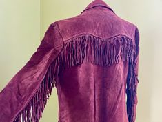 This western 80's jacket will be a super cool addition to your wardrobe.  Please note the colour is more of a chocolate brown than the red brown in the first few photos.   This vintage jacket has been crafted from a sturdy suede in a chocolate brown.  It has a large notched collar, 3 button closure and two fringed patch pockets. The front and back have western-style yokes which are trimmed with suede fringing, as are the sleeves.  Deceptively versatile, this jacket would look amazing paired with any kind of denim - from skinny jeans, flares or slouchy 90's styles. It would also look cute worn oversized with a boho dress and ankle boots.  Size Small. Measurements: Chest: 94 cm / 36 inches Shoulder: 45 cm / 18 inches Sleeve: 57 cm / 22 inches Length: 77 cm / 30 inches This item is one of a k 80's Jacket, Sherpa Sweater, Western Brown, 80s Jacket, Vintage Leather Belts, Purple Jacket, Brown Silk, Suede Fringe, Brown Jacket