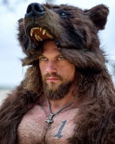 a man wearing a bear's head and beard