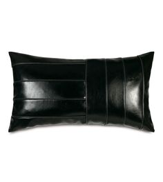 a black leather pillow on a white background