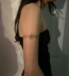 a woman with a tattoo on her arm