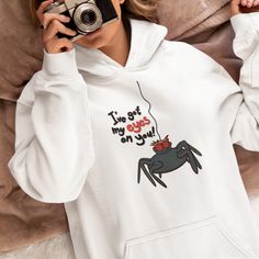 Peek-a-BOO! This cute spider has its eyes on you! 🕷️👀 A bit fun for the upcoming spooky season, this design is available on t-shirts, hoodies, mugs, tote bags an more in our The Artful Geeks Zazzle store🛍️🕷️🖤 Spider Cartoon, Cute Spider, Peek A Boo, My Eyes, Tote Bags