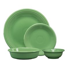 green dinnerware set on white background