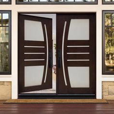 the front door to a house with two glass doors on each side and an entry way