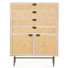 a white dresser with four drawers and wicker handles