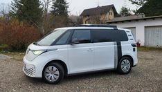 a white van parked in front of a house