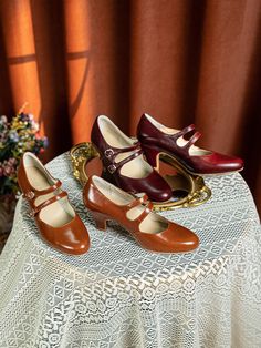 Embrace the charm of the 1930s with these timeless Double Strap Mary Jane Heels, designed for those who appreciate vintage elegance with a modern twist. Handcrafted from supple cowhide leather, these heels feature a rich brown hue that captures the essence of retro fashion. The double adjustable straps not only add to the classic Mary Jane silhouette but also provide a secure and comfortable fit, making them perfect for all-day wear. The interior is lined with soft pigskin for a luxurious feel, while the sheepskin insole offers cushioning with every step. The rubber outsole ensures durability and a confident stride, no matter where your day takes you. Standing on a graceful 2.5 inches (6.5 cm) heel, these shoes offer the perfect balance of height and comfort, allowing you to step back into Vintage Shanghai, Classy Heels, Antoinette Dress, Wedding Dresses High Low, Champagne Evening Dress, Fairy Wedding Dress, Sequin Evening Gowns, Ankle Pain, Pink Formal Dresses