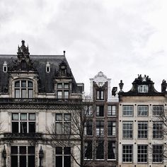 an old building with many windows and balconies