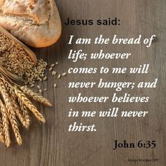 bread and wheat on a wooden table with the words jesus said i am the bread of life whoever comes to me