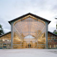 a large building with glass doors and windows