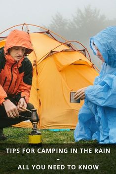 two people in rain gear sitting next to a tent with the words tips for camping in the rain all you need to know