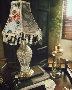 a table with a lamp and some books on it