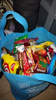 a blue bag filled with lots of candy