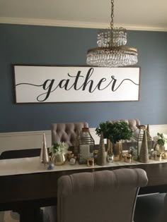 a dining room table with chairs and a chandelier