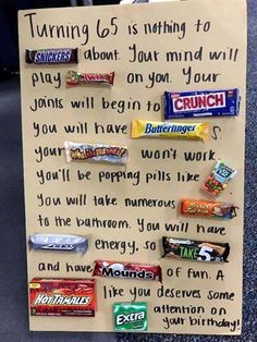 a paper sign with candy bars on it