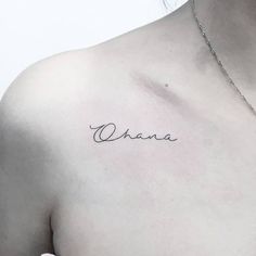 a woman's chest with the word ohana tattooed on her left side ribcage