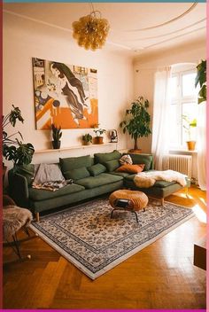 a living room with green couches and rugs on the floor in front of a window