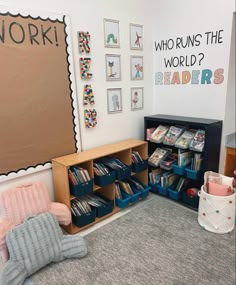 a child's room with bookshelves, toys and pictures on the wall