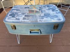 an old blue suitcase with newspaper on it