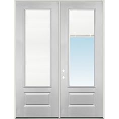 a white double door with blinds on the side