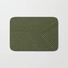 an olive green placemat with wavy lines on the edge, and a white background