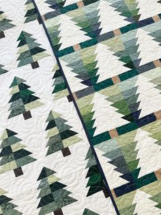 two quilts that have been made to look like christmas trees with green and brown colors