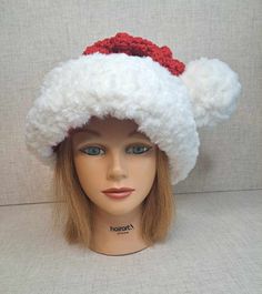 a mannequin head wearing a white and red hat