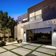 a modern house with an open garage door