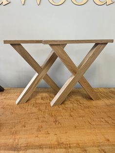 a wooden table sitting on top of a hard wood floor