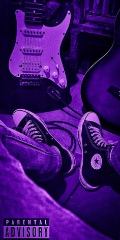 two guitars sitting next to each other in front of a purple background with the words parental advisory on it