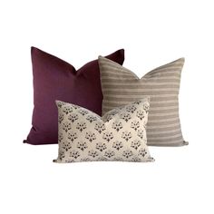 three pillows in various colors and patterns