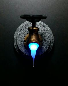 a faucet with blue light coming out of it