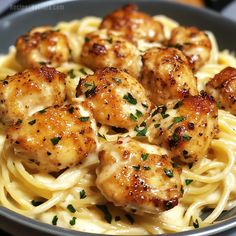 pasta with shrimp and parmesan cheese in a bowl