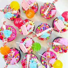 cupcakes decorated with candy and candies on a plate