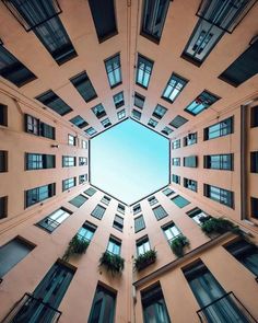 looking up at the sky from inside an apartment building