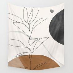 a wall hanging with a plant in the middle and a black dot on the bottom