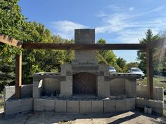 an outdoor oven made out of cinder blocks