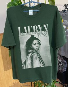 Lauryn Hill Graphic shirt , Retro Country Music Shirt, Lauryn Hill shirt, Hip-Hop Lauryn Tour Shirt,Albums Gift for Men Women Unisex T-Shirt : 100% Cotton (fiber content may vary for different colors) .: Medium fabric (5.3 oz/yd² (180 g/m .: Classic fit .: Runs true to size HOW TO ORDER Pick you favorite design. Review the size & color charts above FIRST and then select shirt size and color from the dropdown menu. Indicate the birthday year in the personalization box. Please note size measuremen Lyric Shirts, Country Music Shirt, Retro Country, Hip Hop Shirts, Country Music Shirts, Lauryn Hill, Music Tees, Retro Shirts, Retro 90s