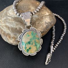 Masha Indian Native American Jewelry   -On Route 66 -         Albuquerque, New Mexico U.S.A     Item Specifics            Stone : Royston Turquoise Size : 20" Pendant Size : 1.75" x 3" Bead Size : 5mm Color : Green Artisan : Gilbert Nez SKU : 14005 Genuine Sterling Silver Jewelry  This beautiful Necklace is made from all 925 Sterling Silver Beads and Findings.  These Beads are meticulously hand strung and assembled by the artist creating the perfect balance of fall, color and shine. Necklaces are a must have for any collection, whether you are just starting out or are a serious collector you will not be disappointed with this work of art. These necklaces have excellent fall and can even be stacked with others, fashioned with a pendant or worn double wrapped to give you different look every Navajo Pearls, Albuquerque New Mexico, Royston Turquoise, Southwestern Jewelry, Fall Color, American Jewelry, Beautiful Necklace, Turquoise Pendant, Native American Jewelry