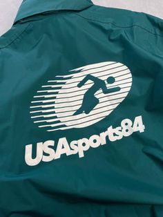 a green jacket with the usa sports logo on it