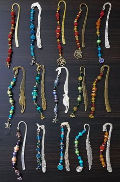 a collection of beaded necklaces and bracelets laid out on a wooden surface