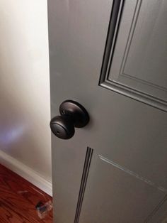 an open door with two knobs on it