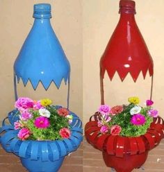 two vases with flowers in them sitting on a table next to each other, one blue and the other red