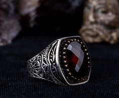 Immerse yourself in the allure of this vintage gothic men's ring, masterfully handcrafted from 925 sterling silver. Showcasing a vivid red zircon stone, this ring captures the elegance of medieval gothic artistry with its intricate details. Perfect for everyday wear or special occasions, this striking accessory adds a unique and dramatic touch to any outfit. Material: 925 Sterling Silver Stone Type:Zircon Stone Dimensions: 16 x 12 mm Average Weight: 19 gr. (depends on your ring size)       Why C Vampire Ring Men, Vintage Statement Rings, Vampire Ring, Vampire Wedding, Red Goth, Gothic Wedding Rings, Gothic Engagement Ring, Goth Guys, Gothic Men