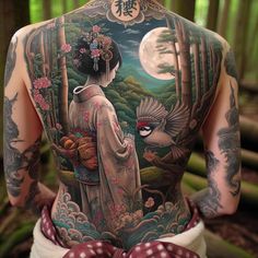 the back of a woman's body with tattoos on it and birds flying around