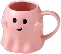 a pink mug with a smiley face on it